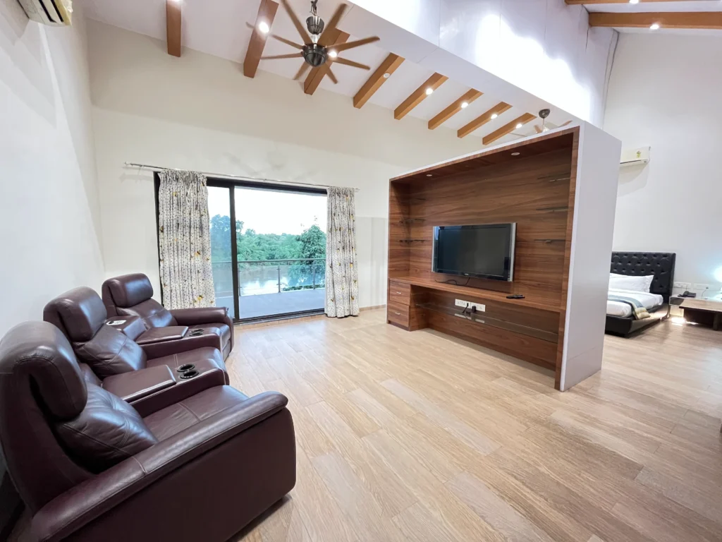 Spacious Living Room with TV & Balcony View